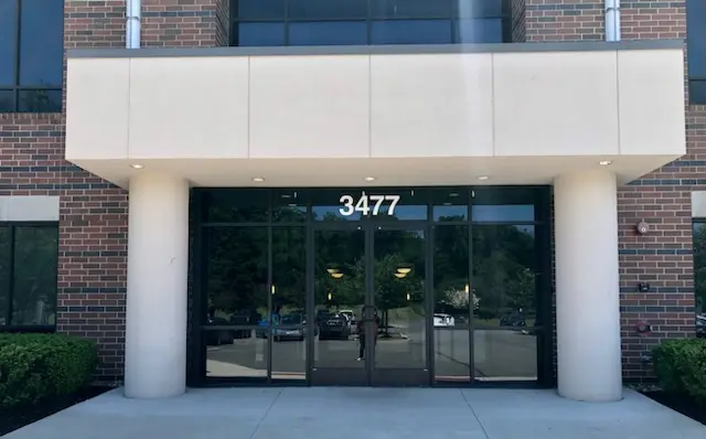 A photo of the entrance to the building where Kate's therapy office is hosted. The address is prominently seen.